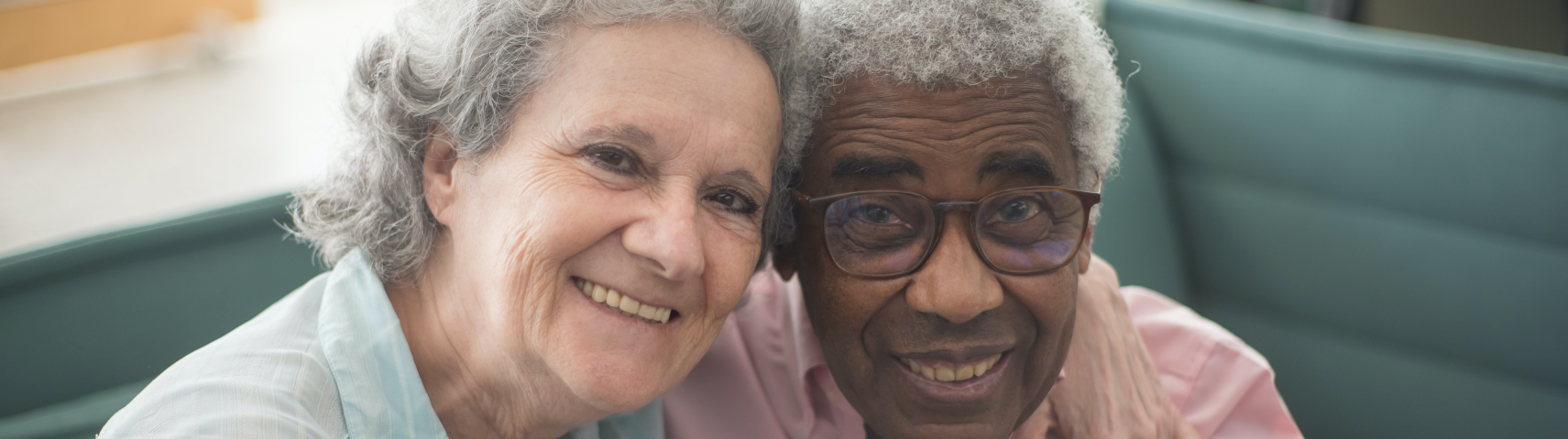 an elderly couple that are happy with each other